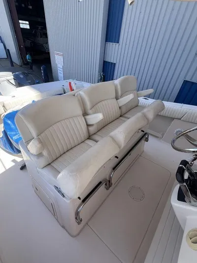  Yacht Photos Pics 2012 Grady-White 336 Canyon boat interior with white cushioned seating.