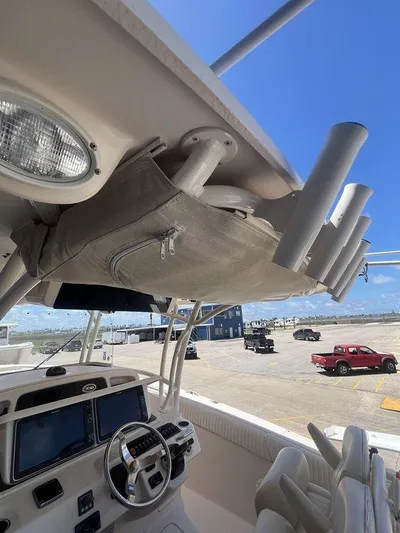  Yacht Photos Pics 2012 Grady-White 336 Canyon boat interior with steering wheel and rod holders.