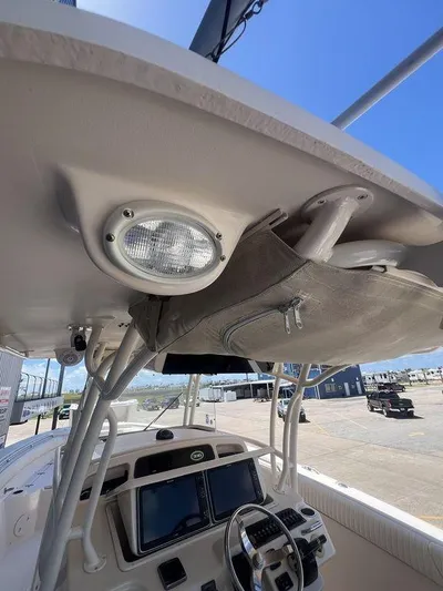  Yacht Photos Pics 2012 Grady-White 336 Canyon boat interior, featuring helm and overhead storage.
