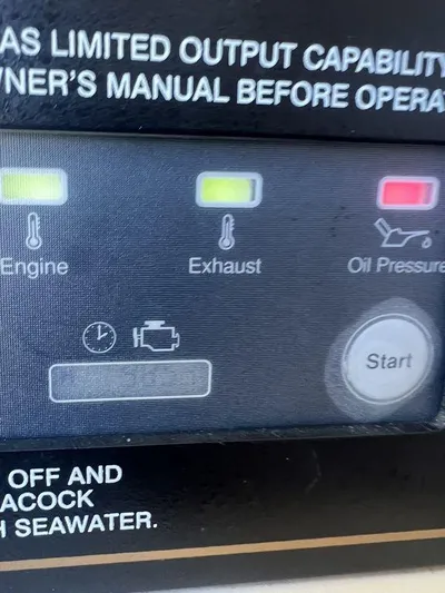  Yacht Photos Pics Control panel of a 2012 Grady-White 336 Canyon boat, showing engine, exhaust, and oil pressure indicators.