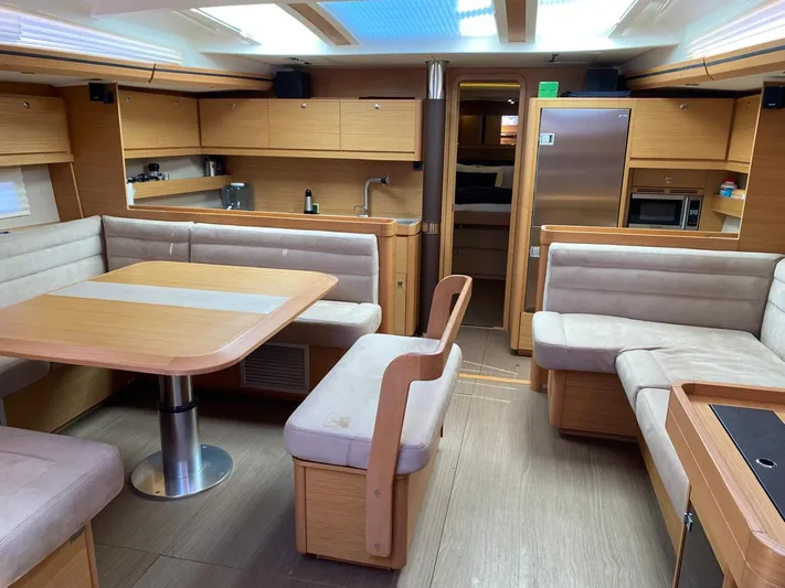  Yacht Photos Pics Luxurious interior of 2017 Dufour Exclusive 56 yacht with modern kitchen and seating area.