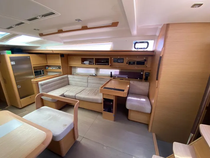  Yacht Photos Pics Luxurious interior of 2017 Dufour Exclusive 56 yacht with modern furnishings and ample seating.