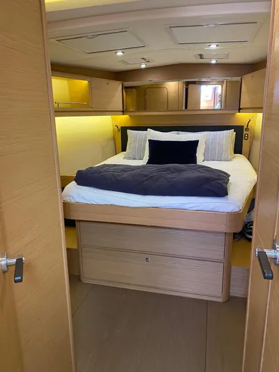  Yacht Photos Pics Luxurious cabin interior of 2017 Dufour Exclusive 56 yacht with cozy bedding.