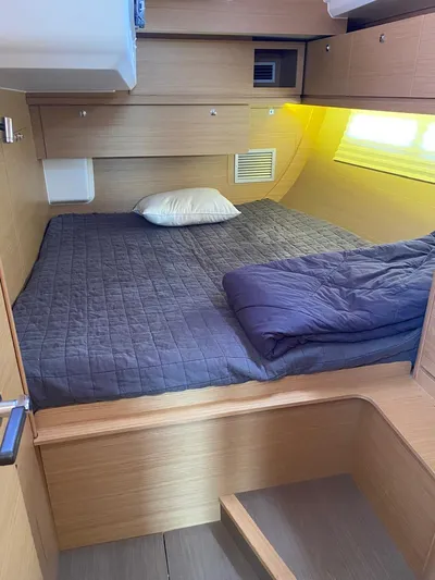  Yacht Photos Pics Cozy cabin interior of 2017 Dufour Exclusive 56 yacht with comfortable bedding.