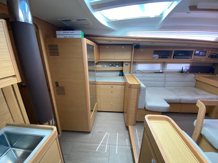  Yacht Photos Pics Luxurious interior of 2017 Dufour Exclusive 56 yacht with modern wood finish.
