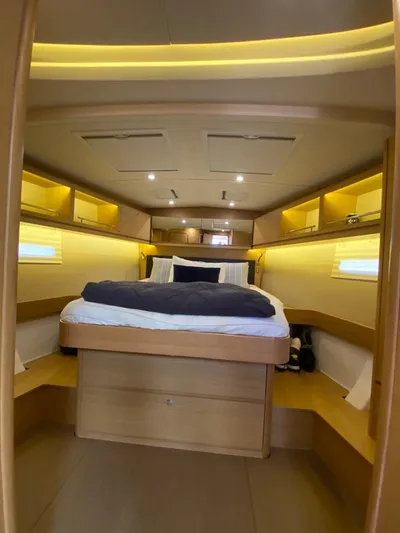  Yacht Photos Pics Luxurious cabin interior of 2017 Dufour Exclusive 56 yacht with cozy bed and ambient lighting.