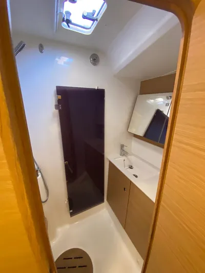  Yacht Photos Pics Modern bathroom in 2017 Dufour Exclusive 56 yacht with sleek fixtures and wood accents.