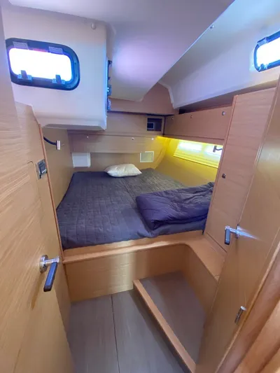  Yacht Photos Pics 2017 Dufour Exclusive 56 yacht cabin with cozy bed and wooden interior.