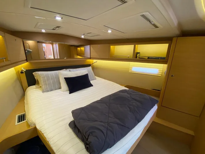  Yacht Photos Pics Luxurious cabin interior of 2017 Dufour Exclusive 56 yacht with cozy bedding.
