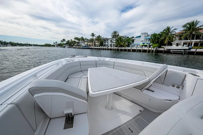  Yacht Photos Pics Luxurious seating area on 2023 Intrepid 427 Nomad SE boat, with waterfront view.