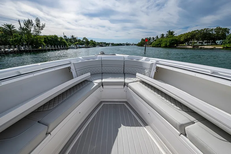  Yacht Photos Pics 2023 Intrepid 427 Nomad SE boat interior with luxurious seating on a scenic waterway.