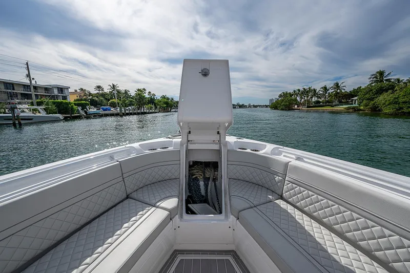  Yacht Photos Pics 2023 Intrepid 427 Nomad SE boat interior with luxurious seating on a scenic waterway.