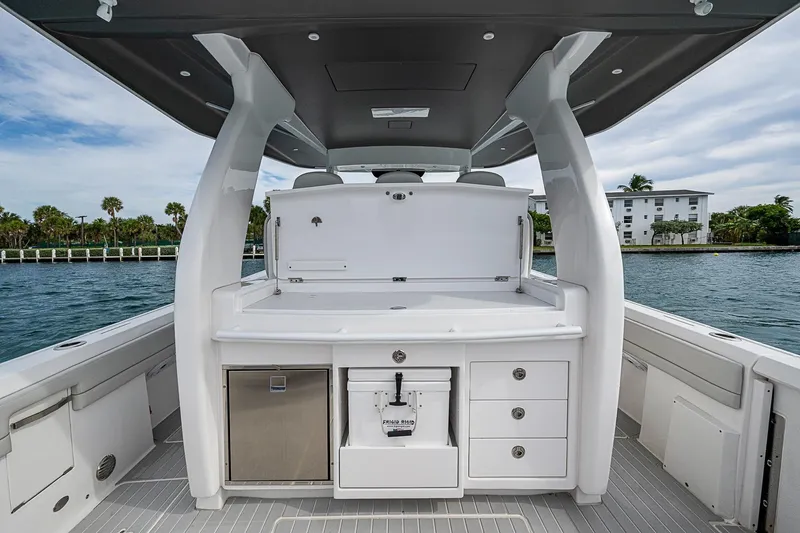  Yacht Photos Pics 2023 Intrepid 427 Nomad SE boat interior with sleek design and storage compartments.
