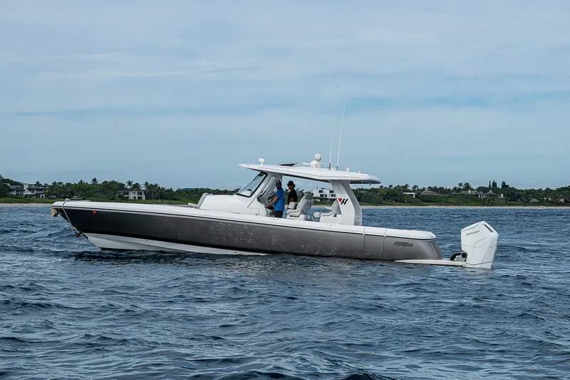  Yacht Photos Pics 2023 Intrepid 427 Nomad SE boat cruising on open water.