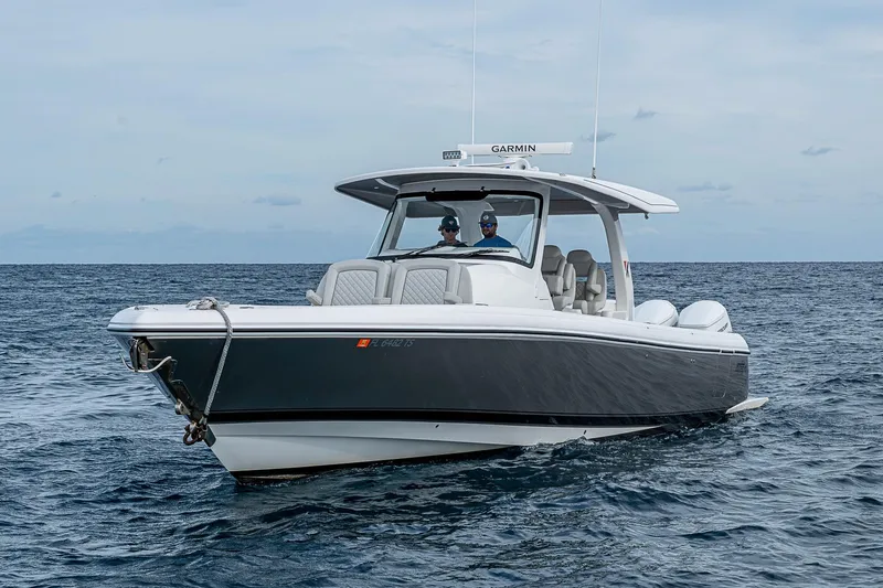  Yacht Photos Pics 2023 Intrepid 427 Nomad SE boat cruising on open water.