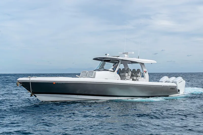  Yacht Photos Pics 2023 Intrepid 427 Nomad SE boat cruising on open water.