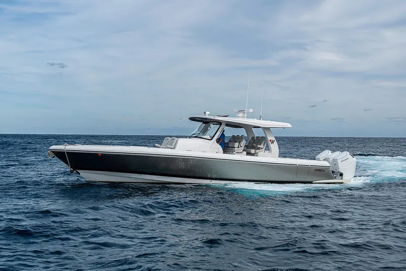  Yacht Photos Pics 2023 Intrepid 427 Nomad SE cruising on open ocean under cloudy sky.