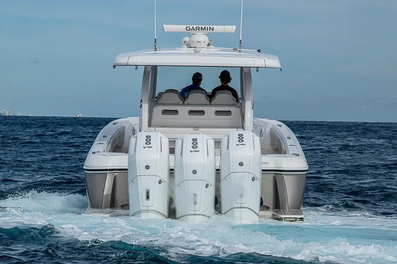  Yacht Photos Pics 2023 Intrepid 427 Nomad SE boat with triple 600 V12 engines cruising on open water.