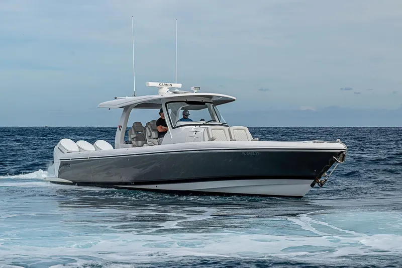  Yacht Photos Pics 2023 Intrepid 427 Nomad SE boat cruising on open water.