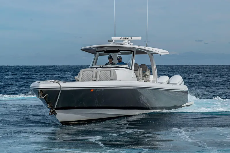  Yacht Photos Pics 2023 Intrepid 427 Nomad SE boat cruising on open water.