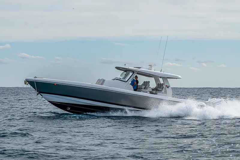  Yacht Photos Pics 2023 Intrepid 427 Nomad SE cruising on open water, showcasing sleek design and performance.