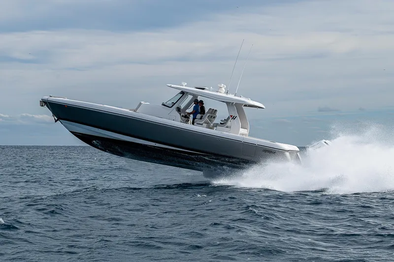  Yacht Photos Pics 2023 Intrepid 427 Nomad SE boat cruising on open water.