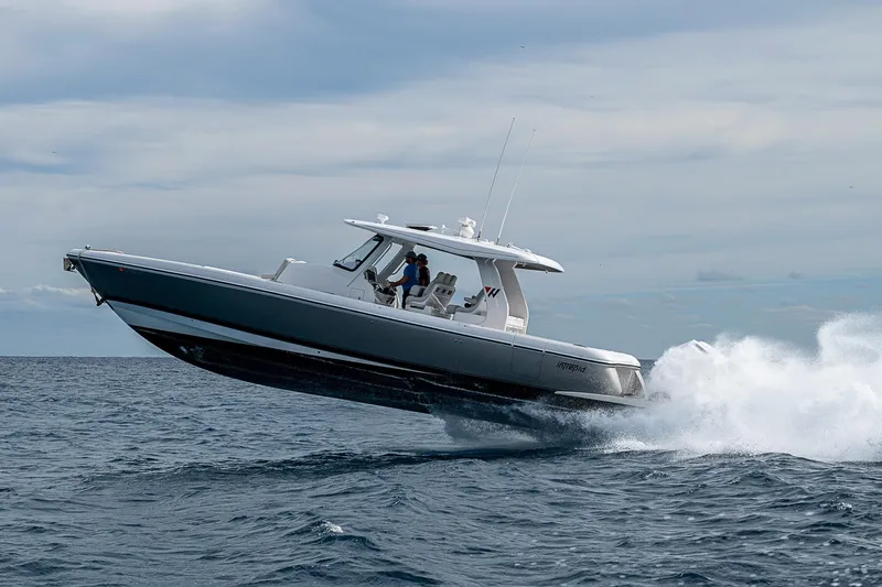  Yacht Photos Pics 2023 Intrepid 427 Nomad SE boat cruising on open water.