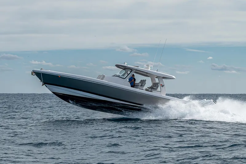  Yacht Photos Pics 2023 Intrepid 427 Nomad SE cruising on open water, showcasing sleek design and performance.