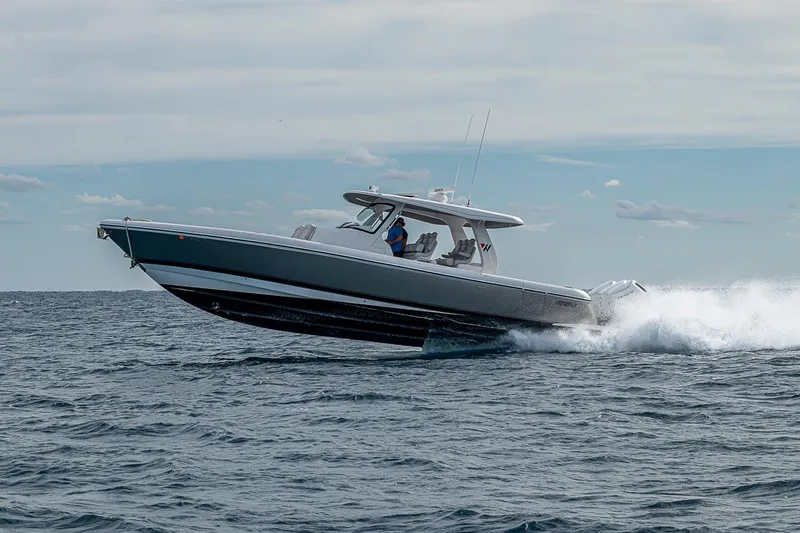  Yacht Photos Pics 2023 Intrepid 427 Nomad SE cruising on open water, showcasing sleek design and performance.