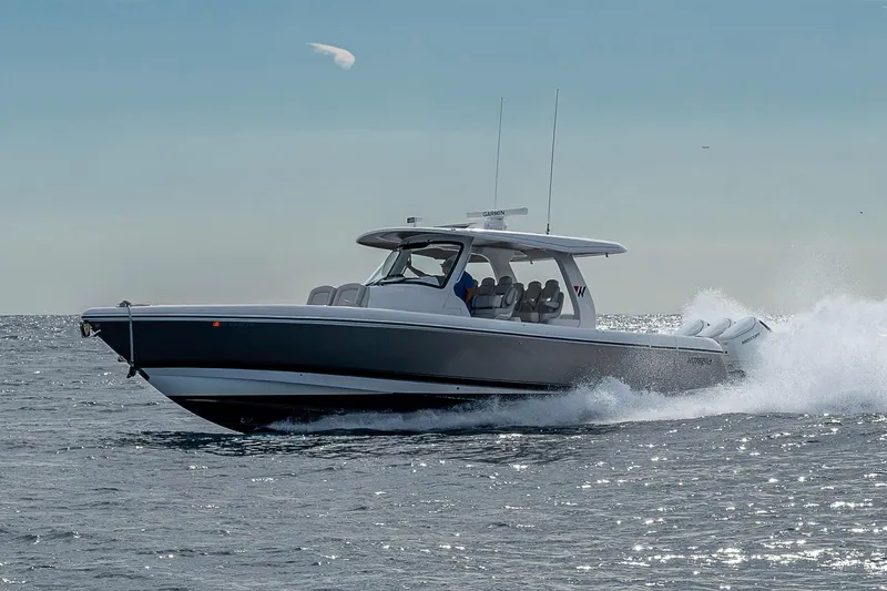  Yacht Photos Pics 2023 Intrepid 427 Nomad SE cruising on open water, showcasing sleek design and performance.
