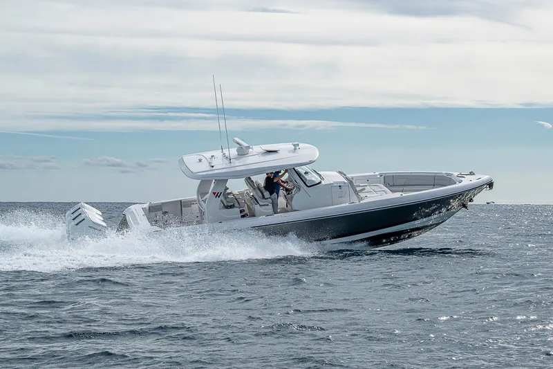  Yacht Photos Pics 2023 Intrepid 427 Nomad SE cruising on open water, showcasing sleek design and powerful engines.