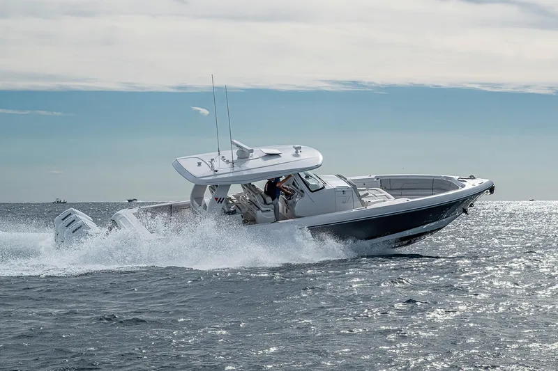  Yacht Photos Pics 2023 Intrepid 427 Nomad SE cruising on open water, showcasing sleek design and powerful performance.