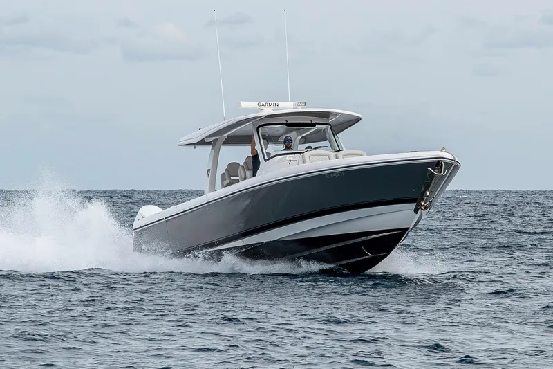  Yacht Photos Pics 2023 Intrepid 427 Nomad SE cruising on open water, showcasing sleek design and performance.