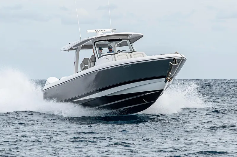  Yacht Photos Pics 2023 Intrepid 427 Nomad SE boat cruising on open water.