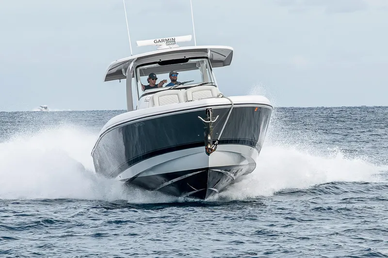  Yacht Photos Pics 2023 Intrepid 427 Nomad SE cruising on open water, showcasing sleek design and performance.