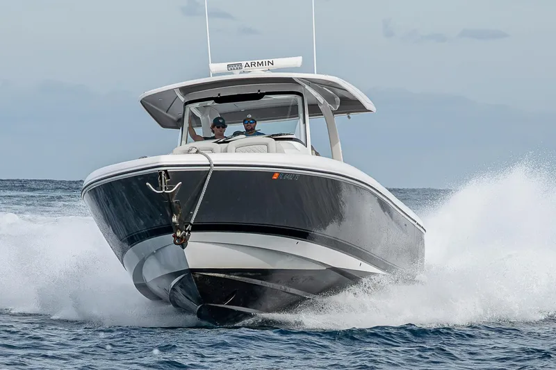  Yacht Photos Pics 2023 Intrepid 427 Nomad SE boat cruising on ocean waves.