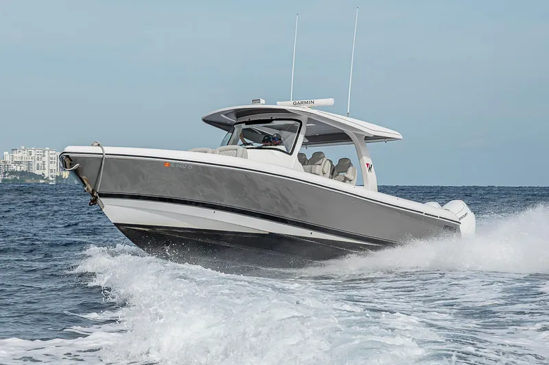  Yacht Photos Pics 2023 Intrepid 427 Nomad SE boat cruising on open water, showcasing sleek design and performance.