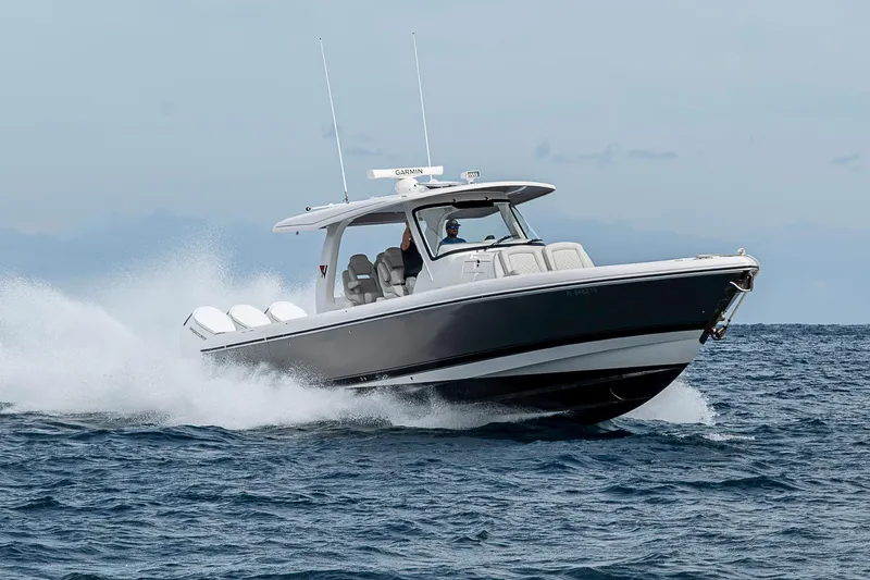  Yacht Photos Pics 2023 Intrepid 427 Nomad SE cruising on open water, showcasing sleek design and performance.