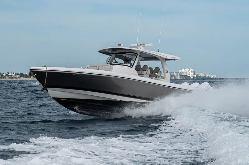  Yacht Photos Pics 2023 Intrepid 427 Nomad SE cruising on open water, showcasing sleek design and performance.