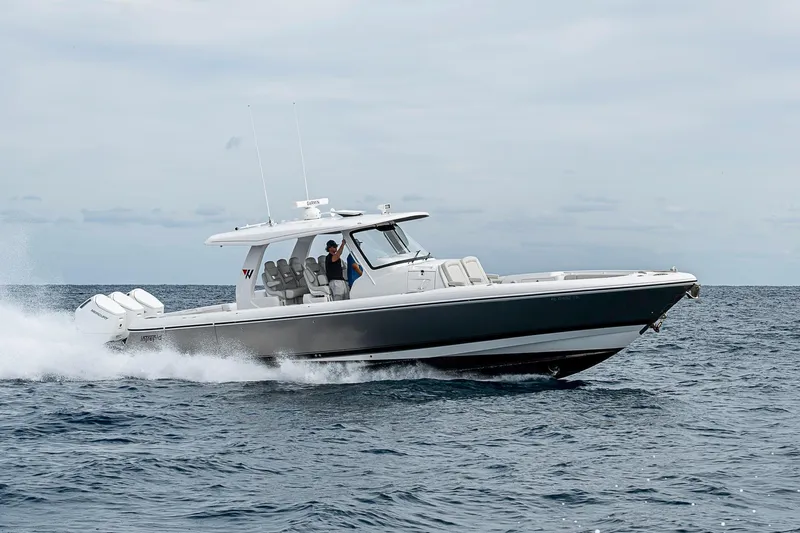  Yacht Photos Pics 2023 Intrepid 427 Nomad SE cruising on open water, showcasing sleek design and powerful engines.
