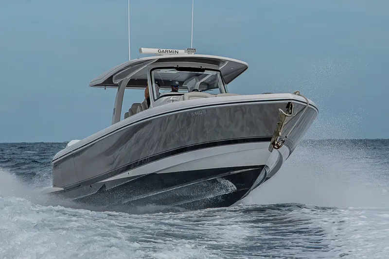  Yacht Photos Pics 2023 Intrepid 427 Nomad SE boat cruising on open water, showcasing sleek design and performance.
