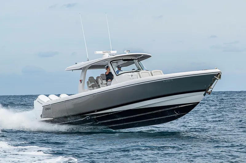  Yacht Photos Pics 2023 Intrepid 427 Nomad SE boat cruising on open water.