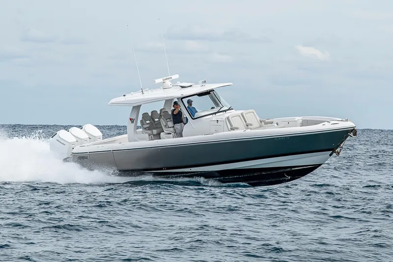  Yacht Photos Pics 2023 Intrepid 427 Nomad SE cruising on open water, showcasing sleek design and powerful engines.