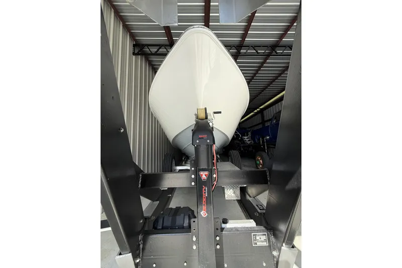  Yacht Photos Pics 2025 Contender 44 ST boat on trailer in storage facility.