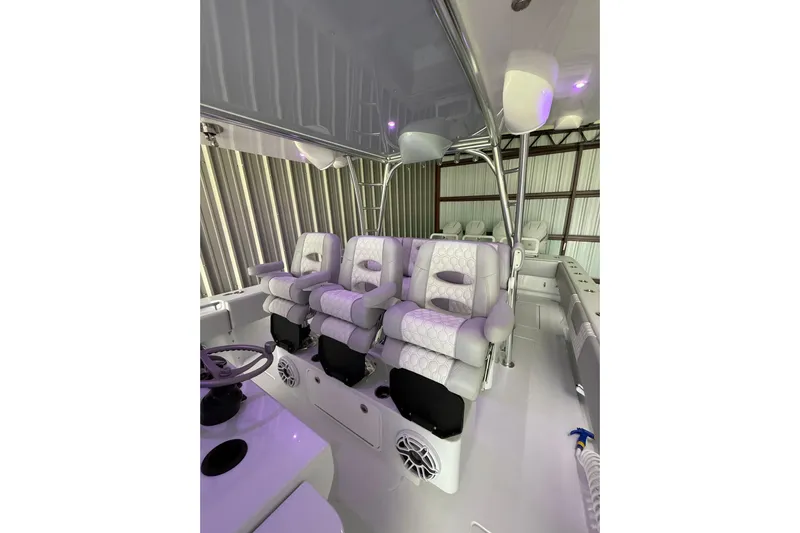  Yacht Photos Pics Luxurious interior of 2025 Contender 44 ST boat with plush seating and modern design.