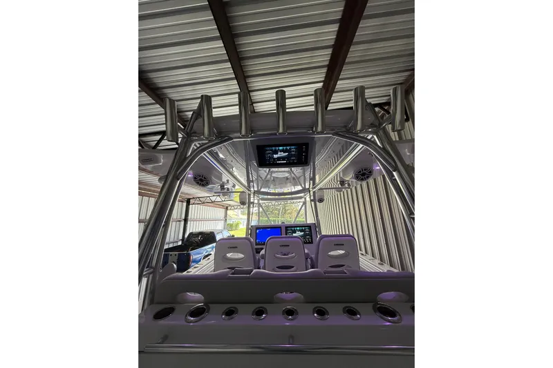  Yacht Photos Pics 2025 Contender 44 ST boat interior with advanced navigation displays and seating.