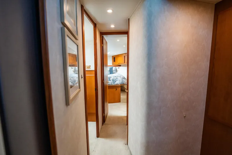 Business Yacht Photos Pics Narrow hallway leading to a cozy bedroom in a 2001 Post 42 model yacht.