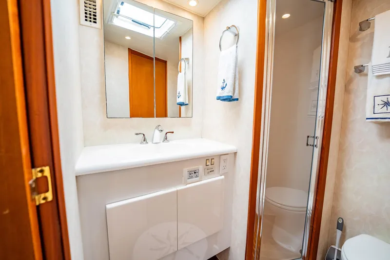 Business Yacht Photos Pics Luxurious bathroom in 2001 Post 42 yacht with modern fixtures and elegant design.