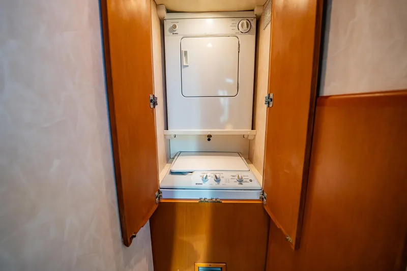 Business Yacht Photos Pics Stacked washer and dryer in wooden cabinet, Post 42 model, 2001.
