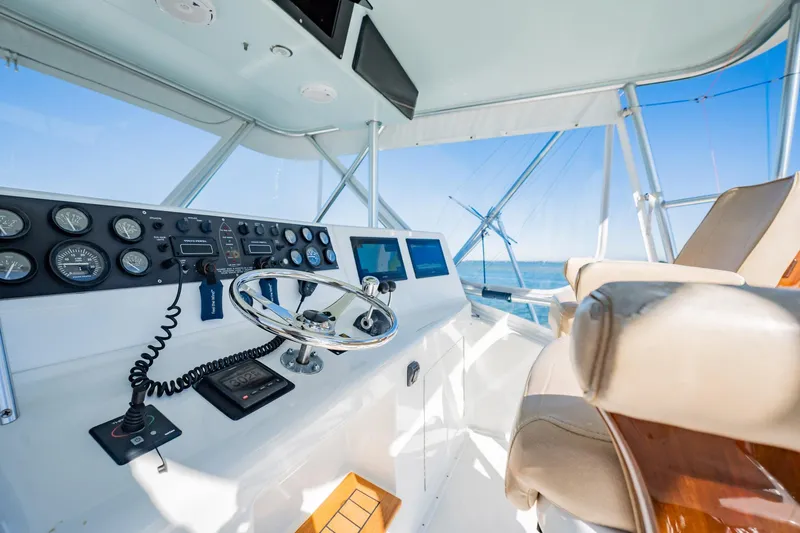 Business Yacht Photos Pics Luxurious yacht helm with modern controls, Post 42 model, 2001, overlooking the ocean.